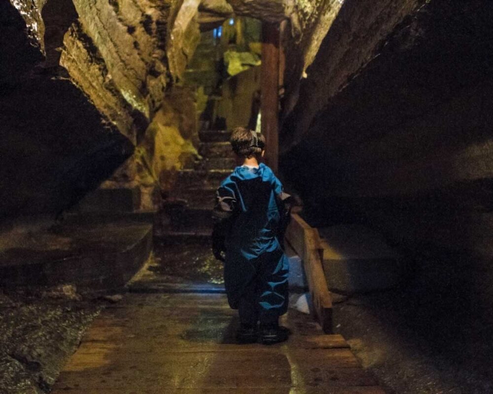 A young boy walks through the Bonnechere Cave system in Ontario