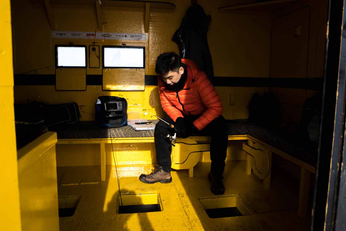 Maiku Wong ice fishing on Lake Scugog