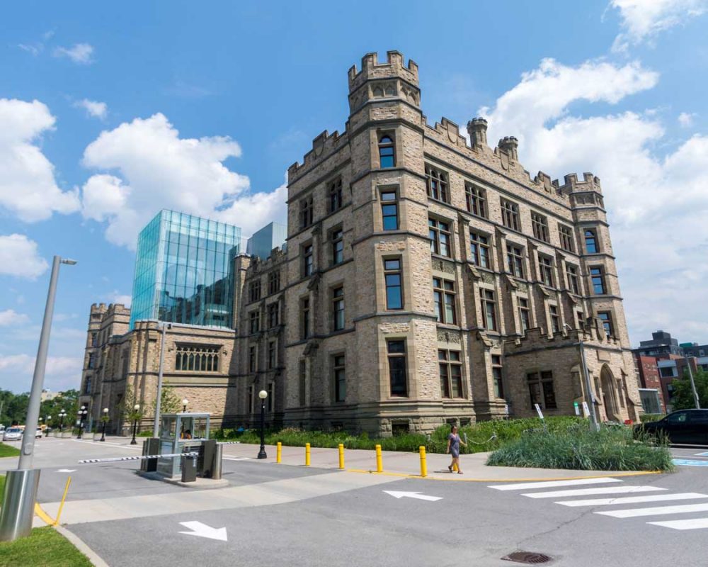 Gothic-style musem with a large glass cube over the main entrance