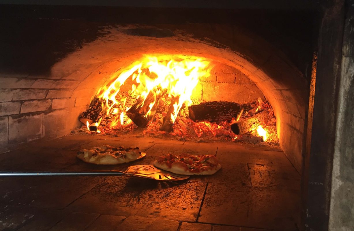 Mouth watering pizza cooking in the wood ovens at Scheuremann Vinyard & Winery