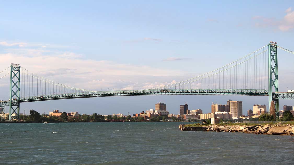 The Ambassador Bridge crosses the Detroit River between Windsor Ontario and Detroit Michigan