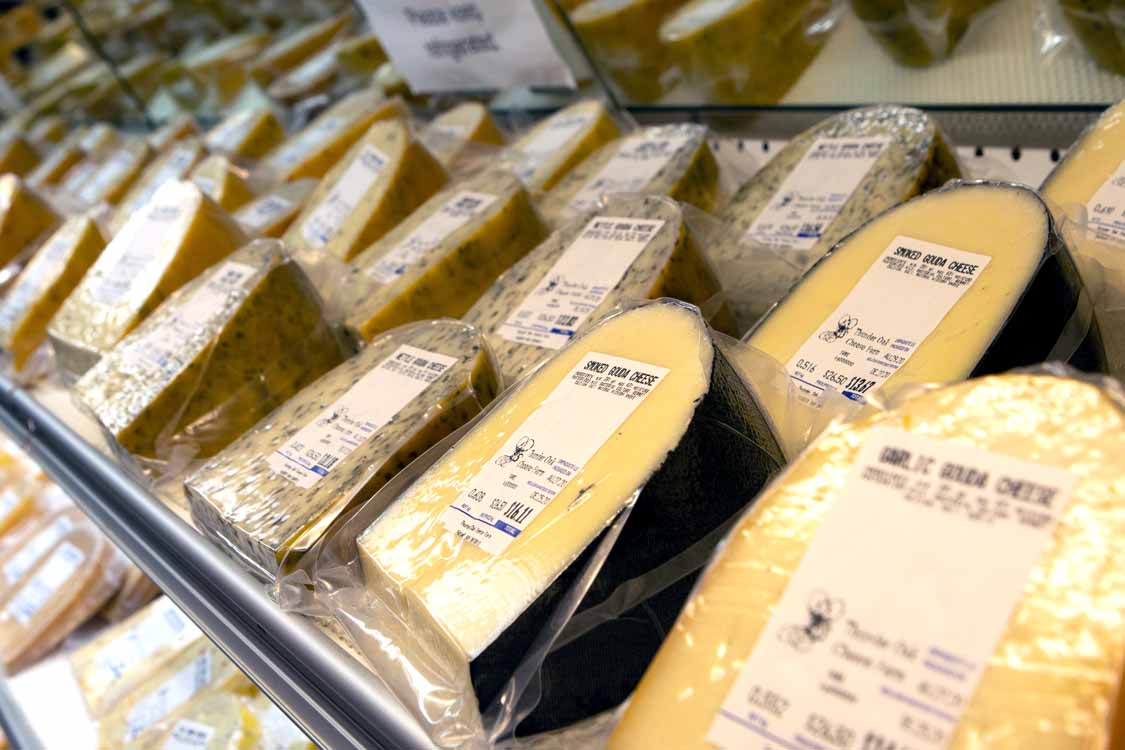 Racks of Gouda cheese at Thunder Oak cheese farm