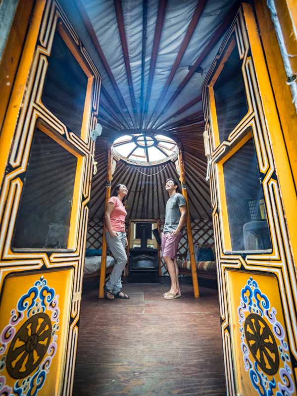 Two people standing in an Ontario glamping yurt in Mattawa