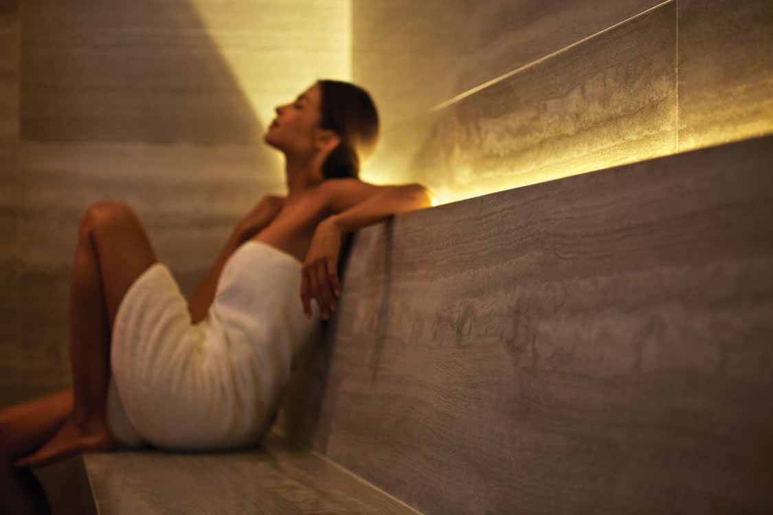 Woman relaxing in a sauna at the Four Season Spa in Toronto