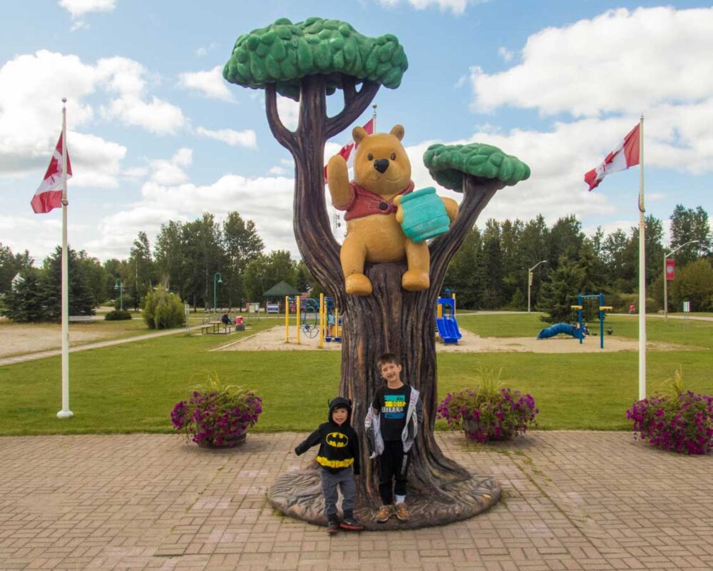 Kids pose with Winnie the Pooh in White River, Ontario