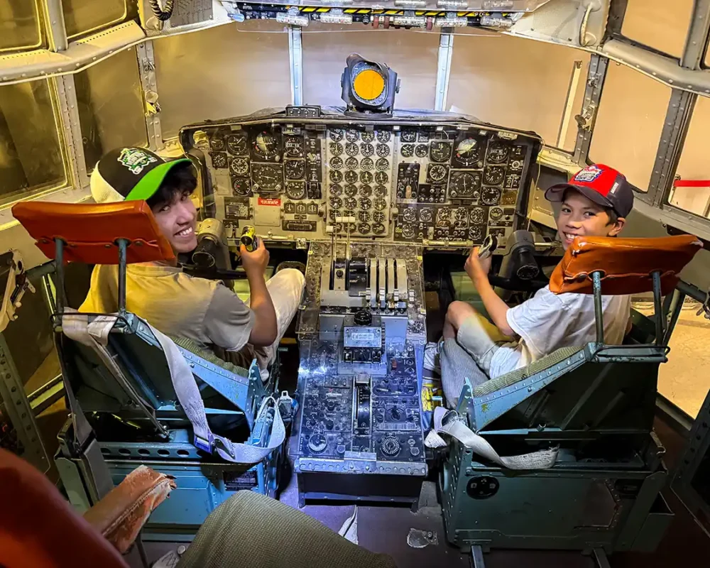 Two boys sit in an aircraft simulator at the Trenton Canadian Forces Base
