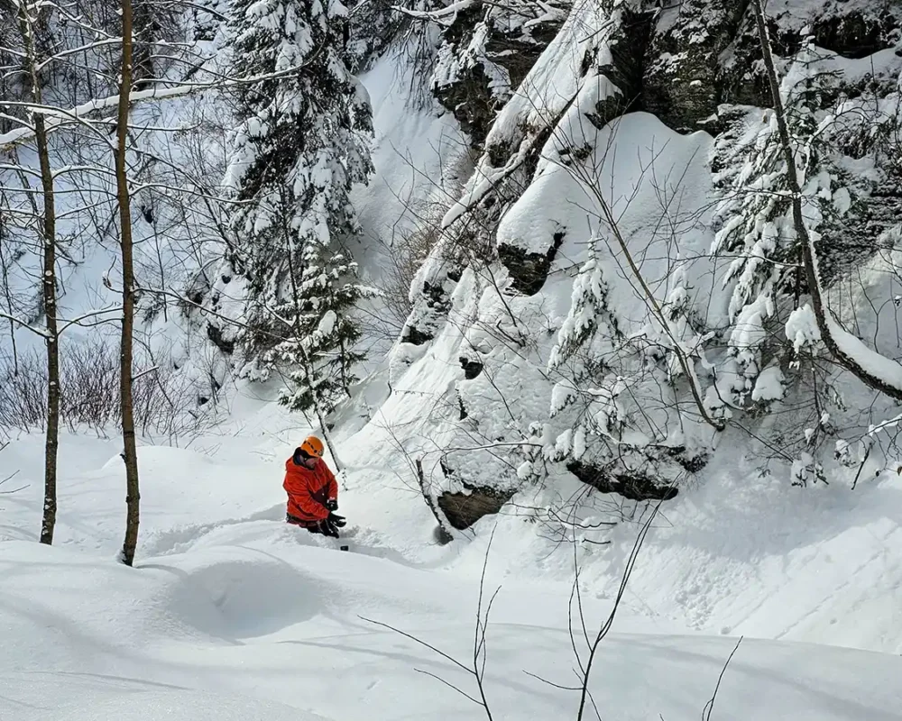 Kevin Wagar trying to set up his GoPro in deep snow.